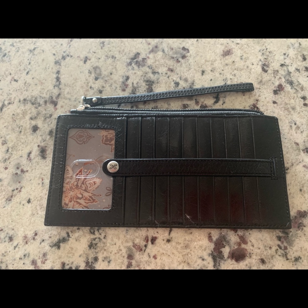 Hobo wallet with wrist strap .